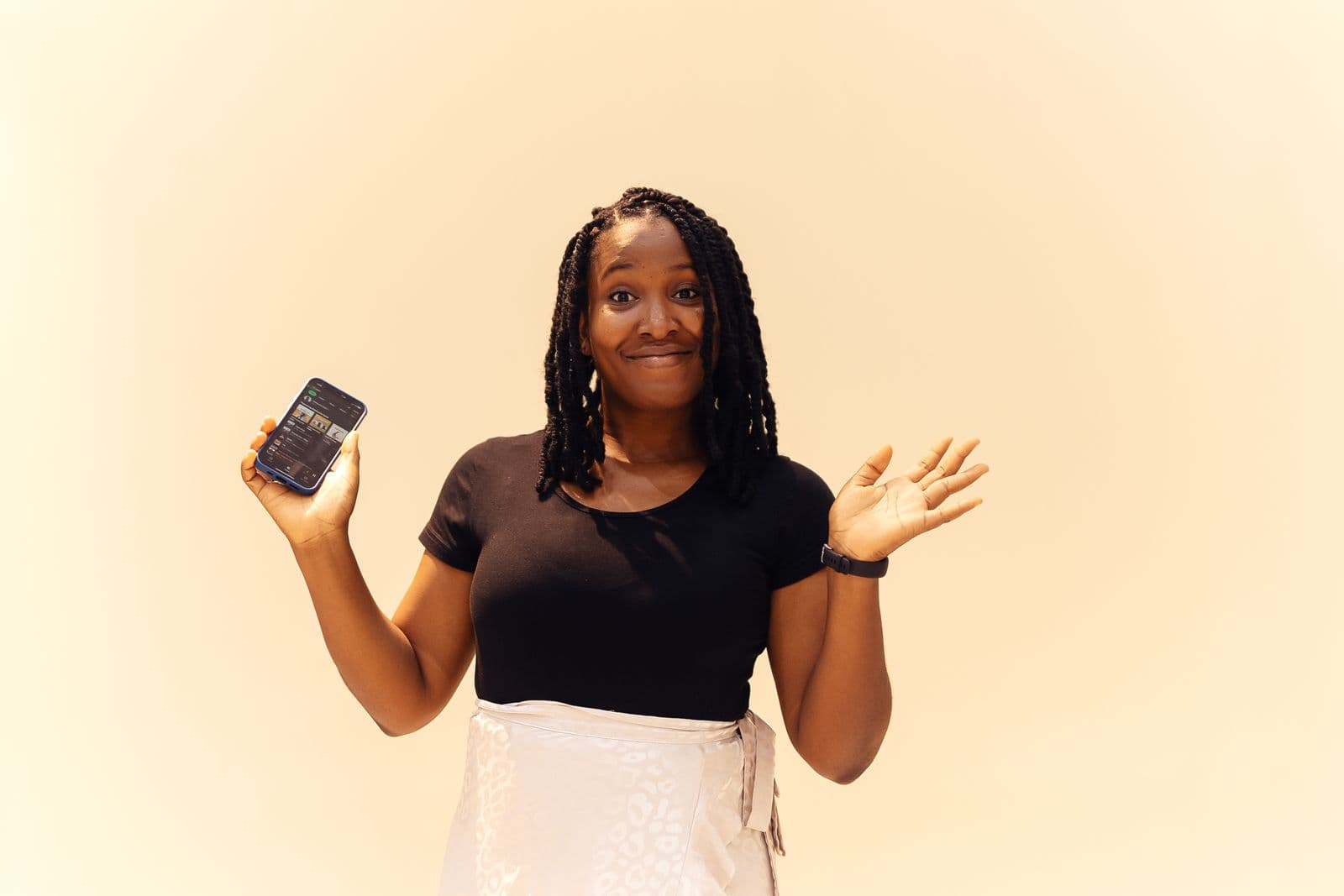 Smiling woman holding her phone
